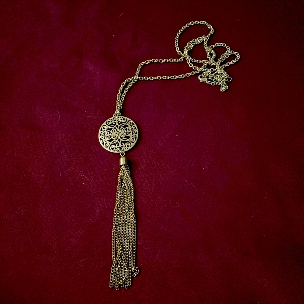 Long chained necklace with tassel chain details.